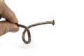 Used crooked rusty nailes on a white. Perseverance and strength Royalty Free Stock Photo