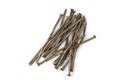 Used crooked rusty nailes on a white. Perseverance and strength Royalty Free Stock Photo