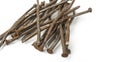 Used crooked rusty nailes on a white. Perseverance and strength Royalty Free Stock Photo
