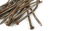Used crooked rusty nailes on a white. Perseverance and strength Royalty Free Stock Photo