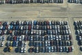 Used damaged cars on auction reseller company big parking lot ready for resale services. Sales of secondhand vehicles