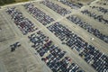 Used damaged cars on auction reseller company big parking lot ready for resale services. Sales of secondhand vehicles