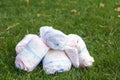 Used dirty diapers on the grass. Ecology, environmental pollution concept.