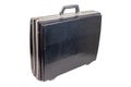 Used and dirty old fashion black plastic suitcase or briefcase isolated on white background, closed and standing up Royalty Free Stock Photo