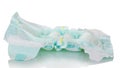 The used disposable diaper is isolated on white background.