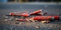 Used fireworks firecrackers lie on asphalt, concept of Spent pyrotechnics