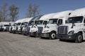 Used Freightliner and International trucks for sale. Pre-owned semi tractor trailer trucks are in high demand Royalty Free Stock Photo