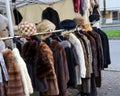 used fur and winter clothes for sale in the flea market stall Royalty Free Stock Photo