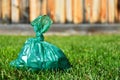 Used Green Dog Poop Bag