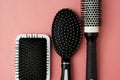 Used Hair brush tools on pink or coral background with copy space. Beauty fashion, hair care background Royalty Free Stock Photo