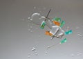 Used injection needles on a mirror surface Royalty Free Stock Photo