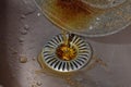 Used kitchen oil poured into the kitchen waste from the marble pan, clogging the waste sink with oil Royalty Free Stock Photo