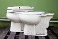 Used of lavatory toilet on pallets.