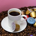 Used Nespresso capsules on coffee beans, the problem of contamination of coffee capsules. Royalty Free Stock Photo