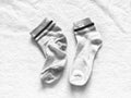 Used and new socks isolated on softness white cotton background