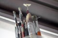 Used oil paint brushes illuminated by daylight filtering through the window. close up. Royalty Free Stock Photo