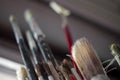 Used oil paint brushes illuminated by daylight filtering through the window. close up. Royalty Free Stock Photo