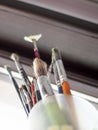 Used oil paint brushes illuminated by daylight filtering through the window. close up. Royalty Free Stock Photo