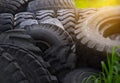 used old car tires pile in the forest. reuse of the waste rubber tyres Royalty Free Stock Photo