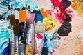 Used paint brushes on a colorful palette Royalty Free Stock Photo