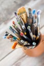 Used painter paintbrushes in a jug from potters clay Royalty Free Stock Photo