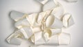 Used paper cups lying on light background, waste sorting problem, environment
