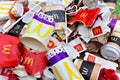 Used paper disposable packs McDonalds. Fast foodÃ¢â¬â¢s litter legacy. Discarded paper coffee cup. Pile of abandoned garbage