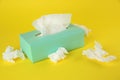 Used paper tissues and box on background Royalty Free Stock Photo