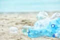 Used plastic bottles on beach, space for text. Royalty Free Stock Photo