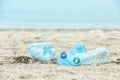 Used plastic bottles on beach, space for text. Royalty Free Stock Photo