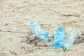 Used plastic bottles on beach, space for text. Royalty Free Stock Photo