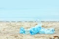 Used plastic bottles on beach, space for text Royalty Free Stock Photo