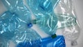 Used plastic bottles lying on light background, dangerous disposals, recycling