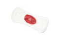 Used sanitary pad isolated on background, top view