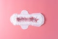 Used Sanitary pad, Sanitary napkin on pink background. Menstruation, Feminine hygiene, top view Royalty Free Stock Photo