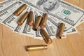 The used shell casings is on a money background Royalty Free Stock Photo