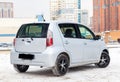 Used silver Toyota Passo with an engine of 1.3 liters rear view on the car snow parking after preparing for sale