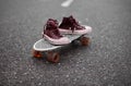 Used sneakers on a skateboard Royalty Free Stock Photo