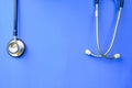 Stethoscope hanging over blue background ideal for medical and healthcare concept