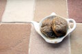 Used teabags on a teabag shaped plate on a kitchen windowsill Royalty Free Stock Photo