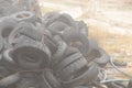Used tires lie on the ground in a landfill in ukraine, an environmental problem of the industry