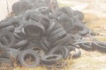 Used tires lie on the ground in a landfill in ukraine, an environmental problem of the industry