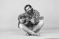 Used to look perfect. favorite tune. Portrait of happy bearded male playing guitar. a lonely musician. cheerful handsome Royalty Free Stock Photo