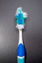 used toothbrush isolated on dark background