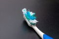 used toothbrush isolated on dark background Royalty Free Stock Photo
