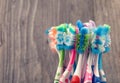 Used toothbrush on wooden background. Royalty Free Stock Photo