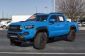 Used Toyota Tacoma at a dealership. With supply issues, Toyota is buying and selling many pre-owned cars to meet demand