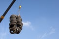 Used tyres hanging on a crane