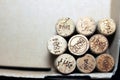 Used wine corks from various varieties of vintage red wine and vintage white wine depicting different dates and years of wine maki Royalty Free Stock Photo