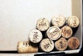 Used wine corks from various varieties of vintage red wine and vintage white wine depicting different dates and years of wine maki Royalty Free Stock Photo